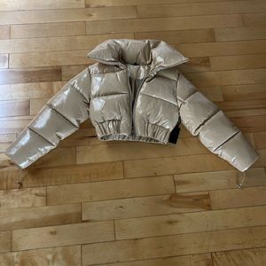 Revolve Puffer Jacket in Tan
